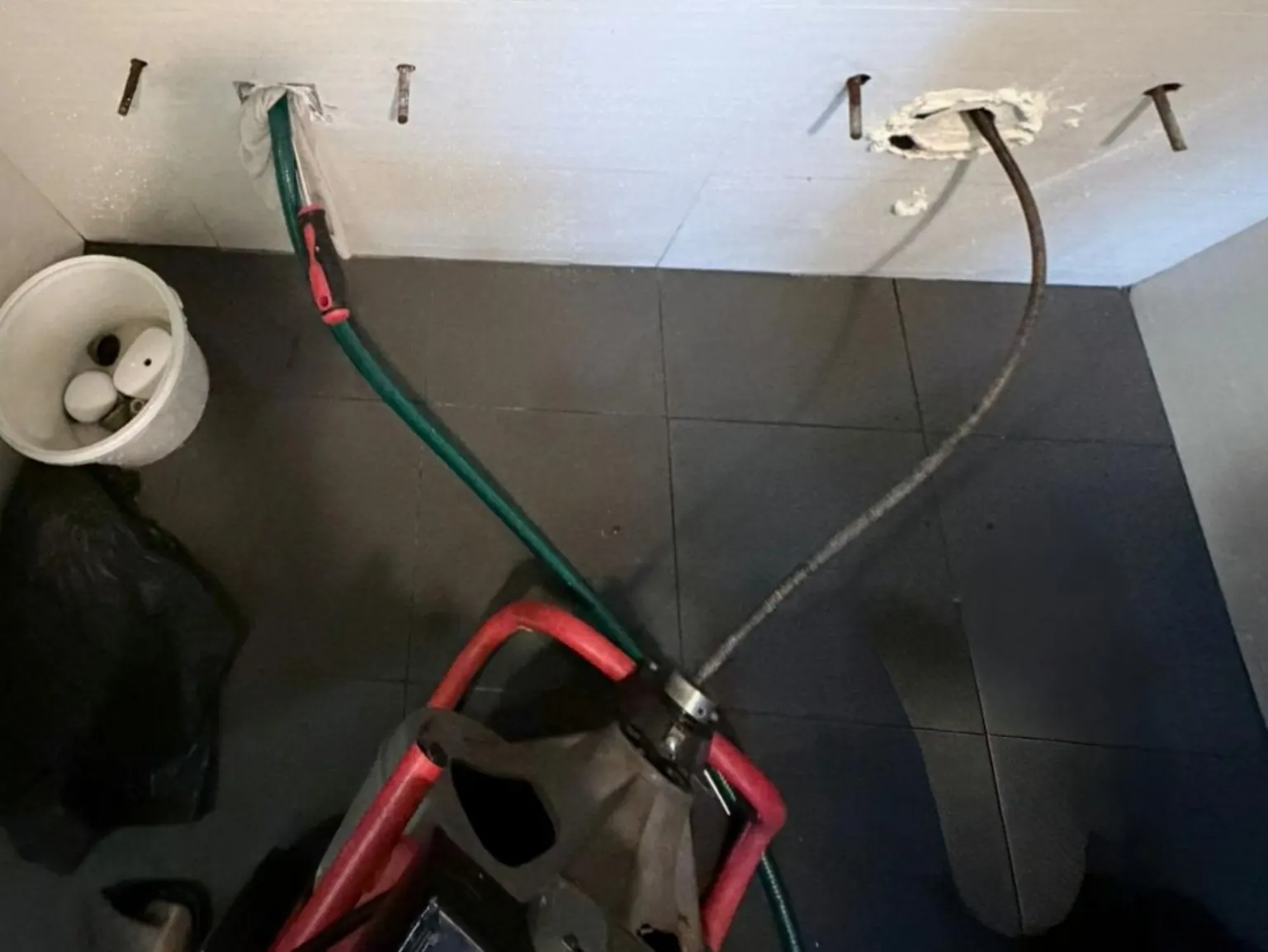 Urinal drainage choke clearing using drain clearing equipment