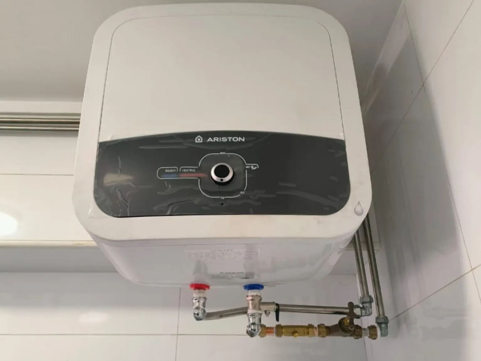 Storage water heater installation with water pipe connections in Singapore