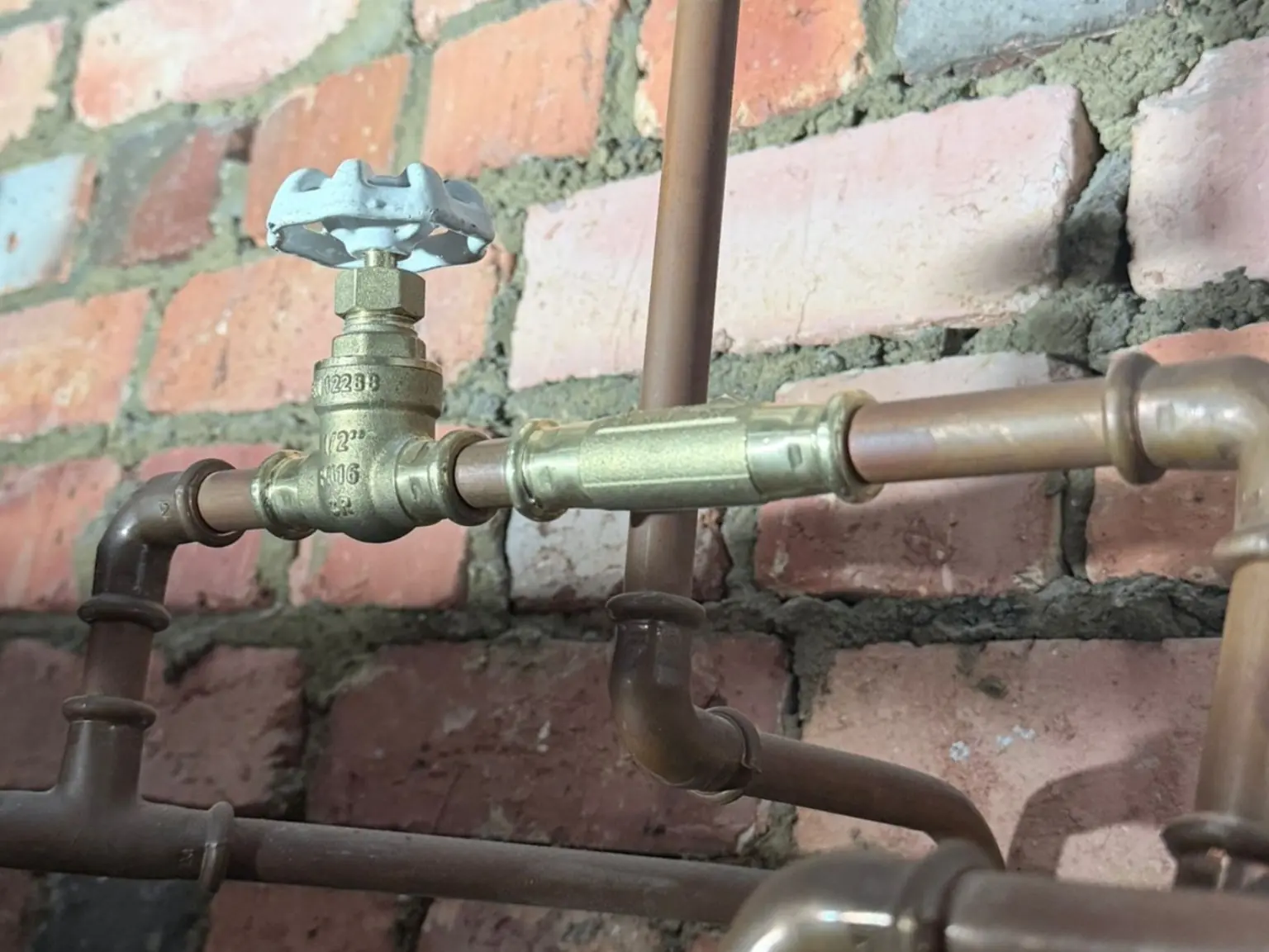 Water heater valve and pipe fitting installation